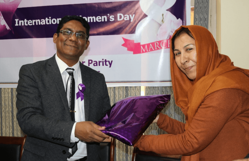 M. Anowar Hossain honors Afghanistan's Health Minister during International Women’s Day celebration.